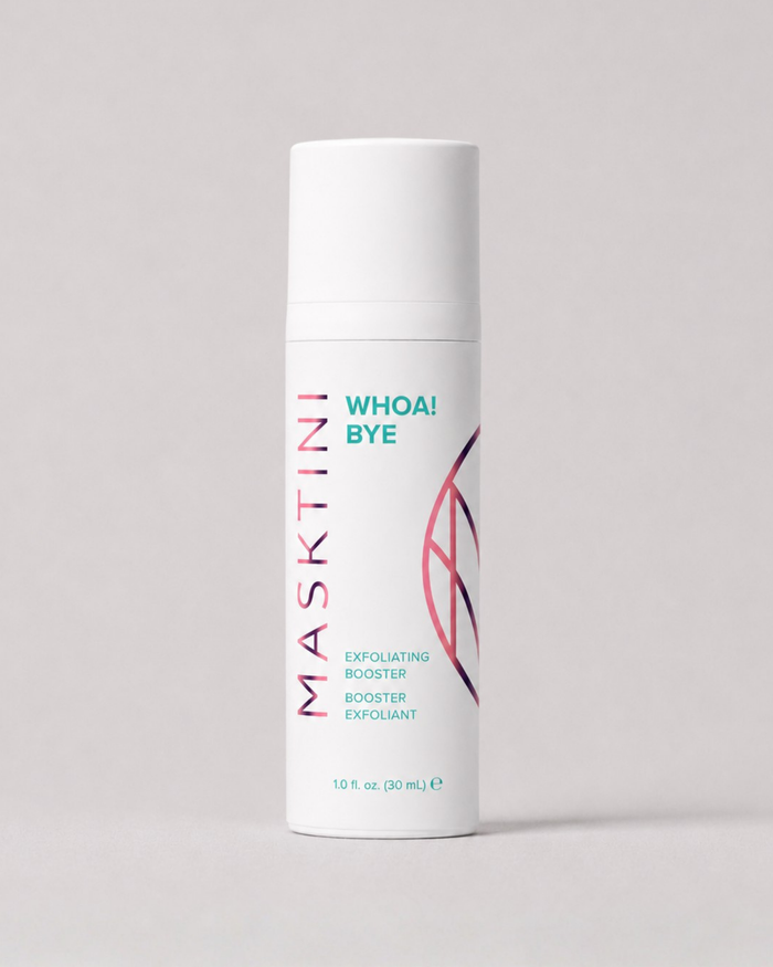 A white cylindrical cosmetic bottle labeled MASKTINI WHOA! BYE Exfoliating Booster, standing upright on a light gray background.